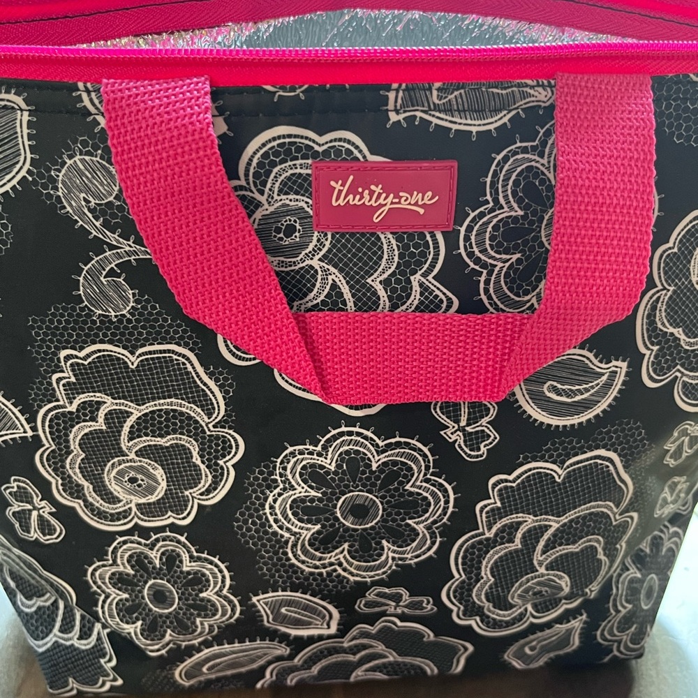 Thirty-One Black and Pink Floral insulted bag/tote. Measures 14” by 10”.
